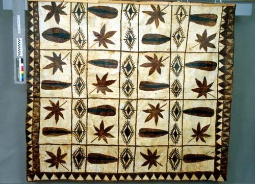 Tapa cloth with brown and black flower-like designs