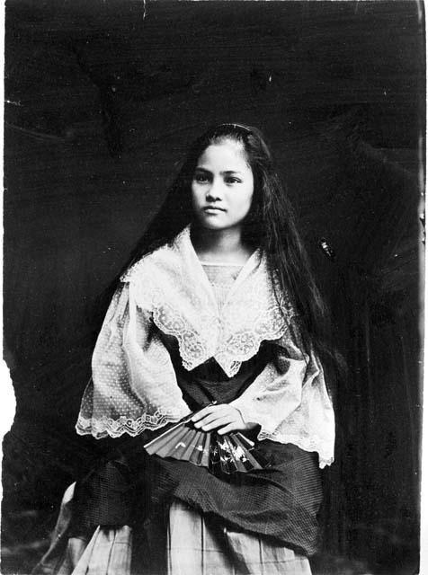 Portrait of young Filipino woman in formal dress