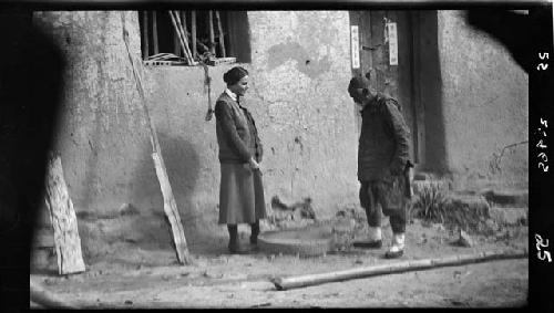 Man and Janet Wulsin stand outside building