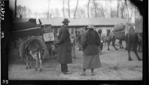 Dockery and Janet Wulsin stand talking in street