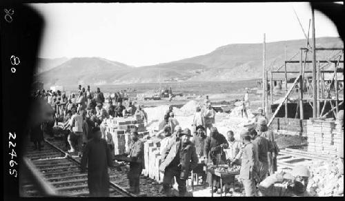 Workers along railroad tracks