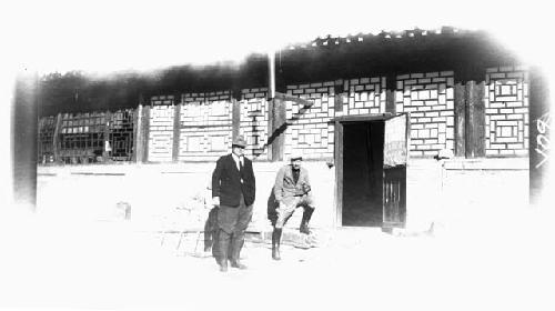 Two men outside building