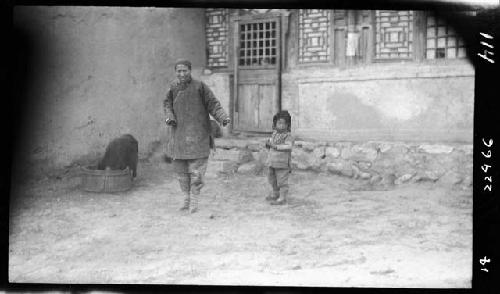 Woman and child in courtyard