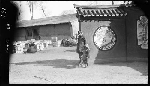 Children stand outside