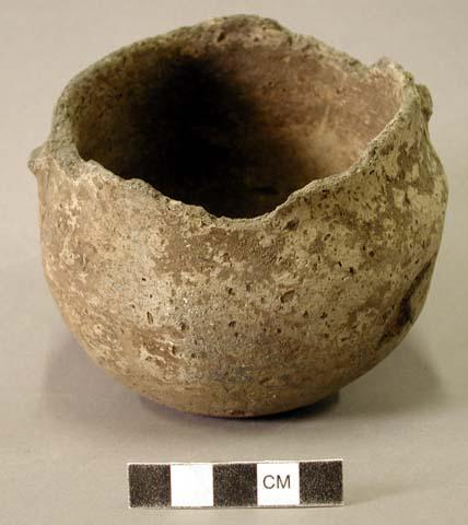 Ceramic vessel, two small protruding handles, spalling around body, damaged rim