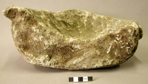 Ground stone mortar fragment