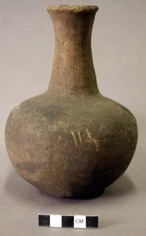 Ceramic jar, long neck, plain, flared at lip, small chip out of lip, flat base