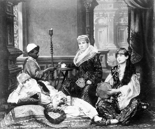 "Turkish ladies taking coffee," studio photograph using models