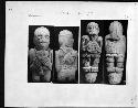 Stone figures with trophy heads and serpent belts