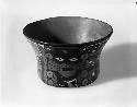 Small bowl of brownware with black bottom and jaguar motif