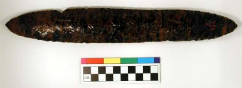 Chipped implement, red & black mottled obsidian