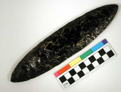 Chipped implement; chipped from black obsidian