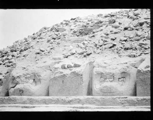 Large colossal heads on front of mound