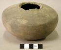 Ceramic complete vessel, broken at neck, plain, flat base
