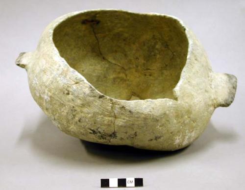 CAST of bowl; 2 horizontal handles; irregular shape