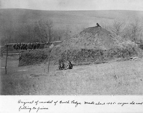 Sod dwelling and the rack on which the braided ears of corn were hung to dry