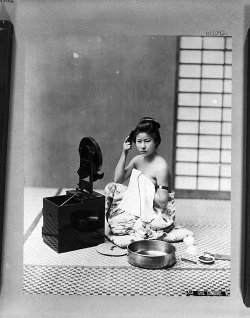 Japanese girl combing her hair