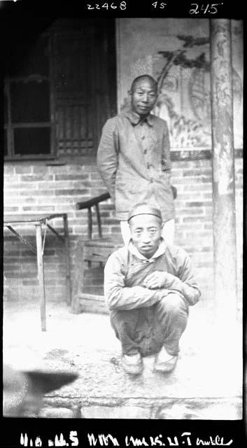 Two men outside building