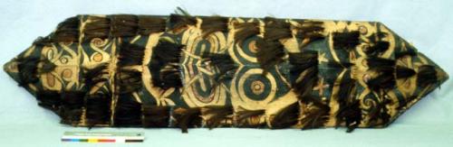 Shield decorated with tufts of human hair