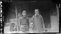 Priest standing with his friend, Hung Djen Djun
