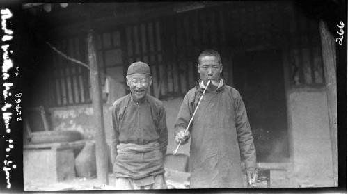 Priest standing with his friend, Hung Djen Djun