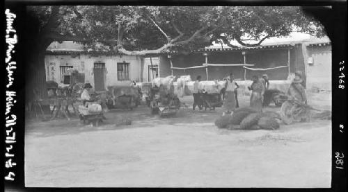 People and carts outside