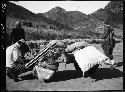 Men load supplies to be carried