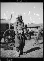 Man stands in front of wagon