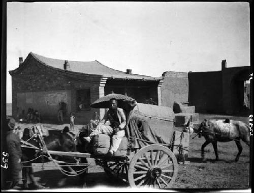 Man riding in wagon