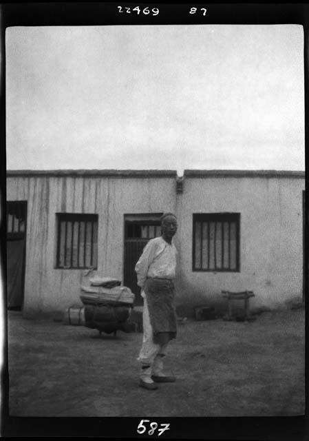 Man stands outside building