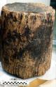 Large wooden mortar for grinding corn. Wood may be cyprus. 36x36x44 cm.