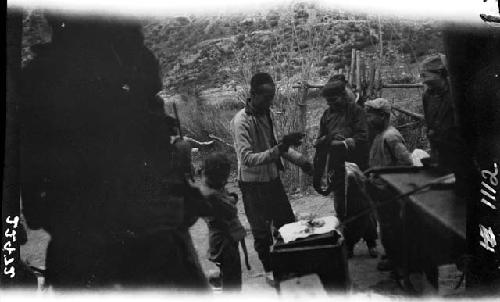 Men and boys gathered outside