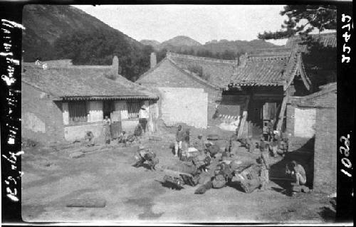 Buildings and open area filled with luggage/cargo