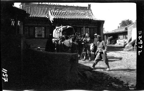 People and wagon on street