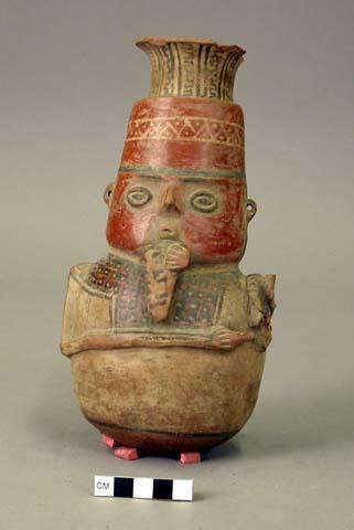 Pottery effigy jar- figure playing panpipe