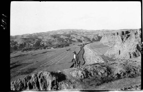 Man standing on natural ledge