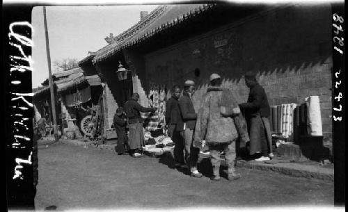 Goods and people along side of road