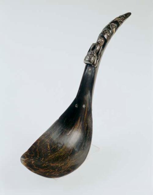 Horn spoon depicting human figures, an owl and frogs