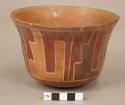 Polychrome pottery bowl with stepped geometric design