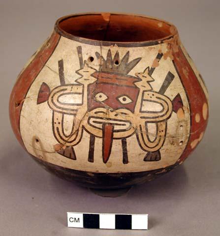 Jar painted in polychrome with three masks