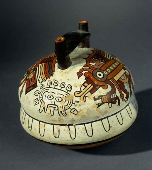 Double spout bottle painted in polychrome with mythical birds and a mask