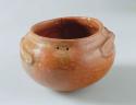Jar with burnished red pigment overall, flared rim, 4 suspension holes - frog ef
