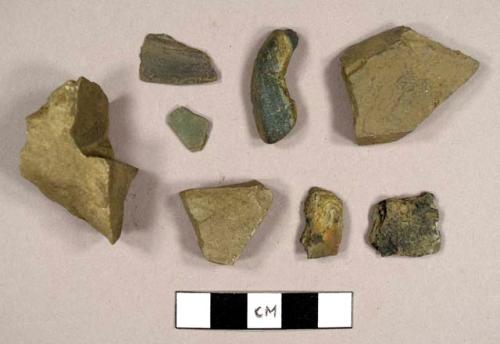 Miscelaneous stone, including two slate fragments, flagstone, and possible charcoal