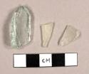 Miscellaneous glass fragments, two colorless curved fragments, one aqua flask base