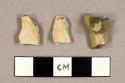 White kaolin pipe bowl fragments, one with slight stump attached