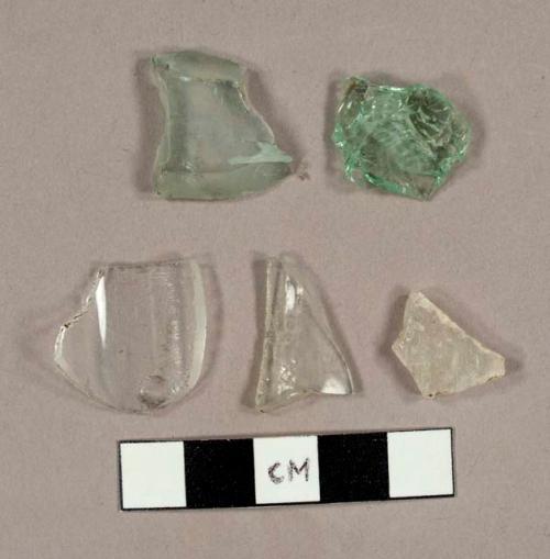 Miscellaneous curved glass fragments, including three colorless glass fragments from a lamp and eight aqua bottle glass fragments