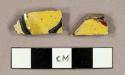 Earthenware sherds with handpainted yellow, red, blue, and white polychrome decoration on exterior and white interior