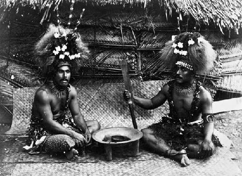 Two men drinking kawa