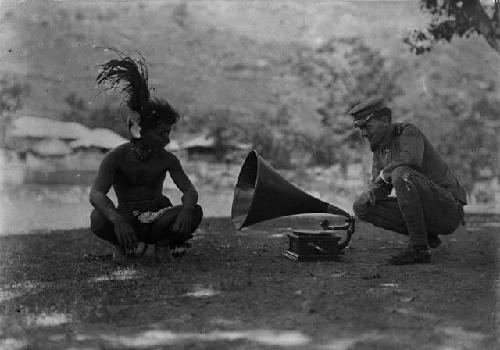 Lieutenant Gilfillen, Philippines Constabulary, playing a phonograph