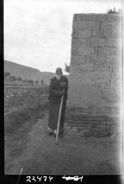 Man standing with staff